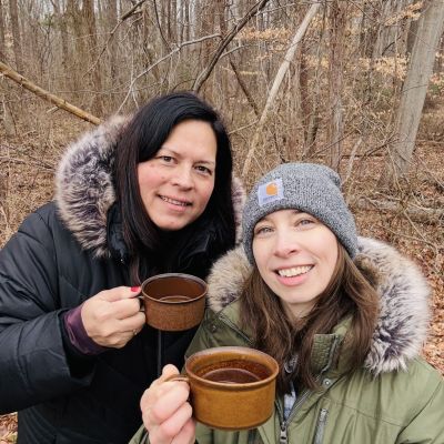 Ana Ka'ahanui, podcast guest featuring forest bathing, drinking tea during a forest bathing activity with podcast host, Jessica Bowser