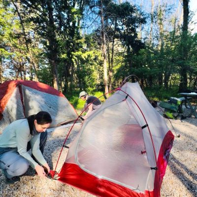 Show Host Jessica Bowser and Ranger Amelia Hulth setting up their tents at camp at a primitive campground in a Virginia State Park.